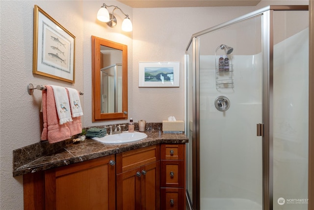 bathroom featuring vanity and walk in shower