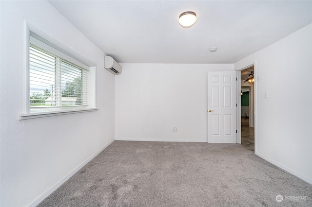 carpeted empty room featuring a wall mounted air conditioner