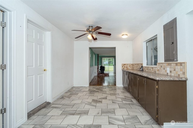 kitchen featuring decorative backsplash, dark brown cabinets, and ceiling fan