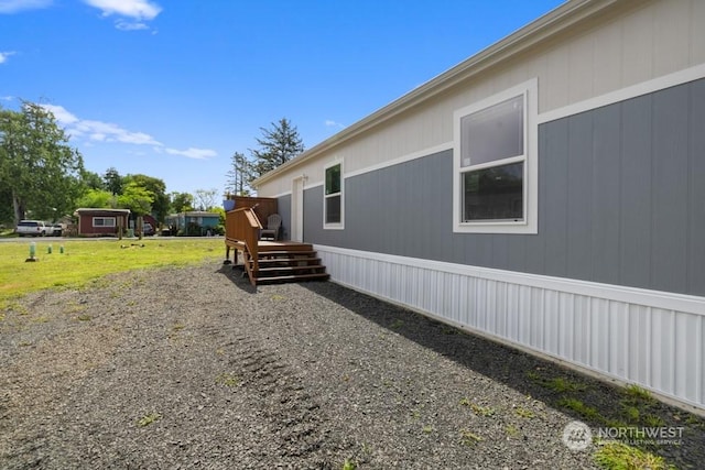 view of side of property with a deck