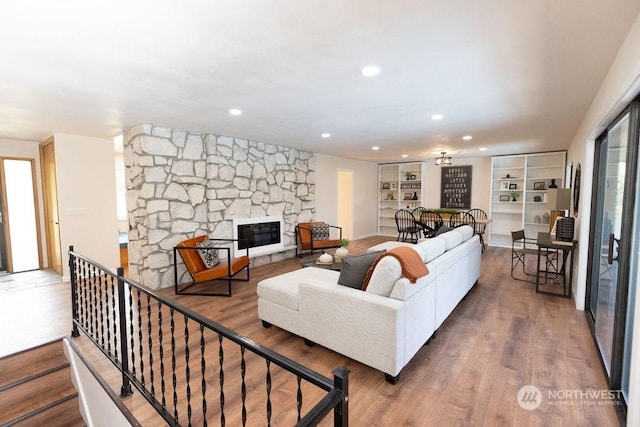 living room featuring hardwood / wood-style flooring and a fireplace