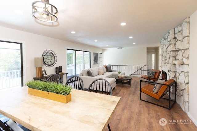 dining space with a notable chandelier and wood-type flooring