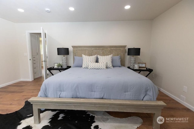 bedroom with hardwood / wood-style floors