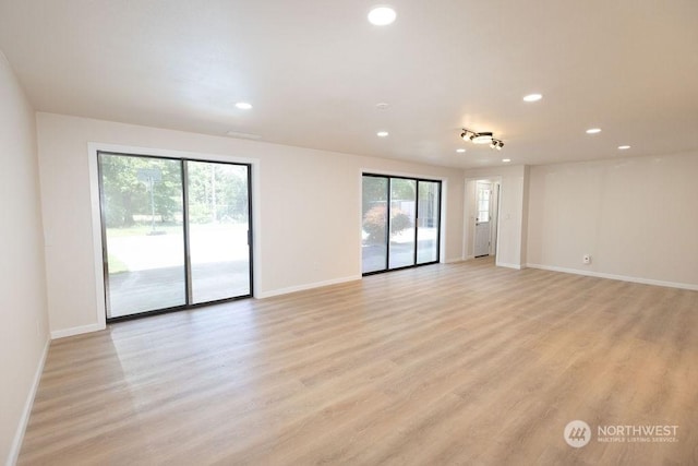 spare room with light wood-type flooring