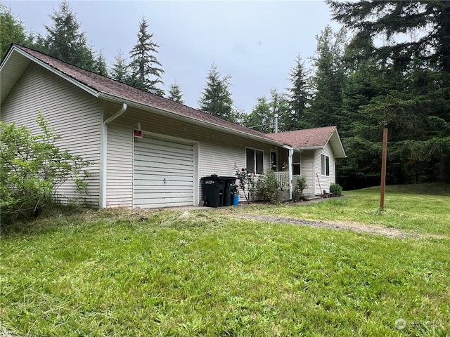 525 Meade Hill Rd, Glenoma, WA 98336 - back of property featuring an attached garage, a yard, and roof with shingles