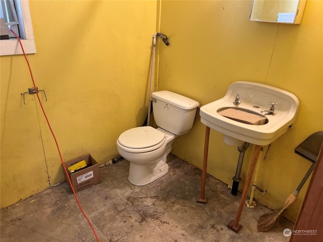 bathroom with sink and toilet