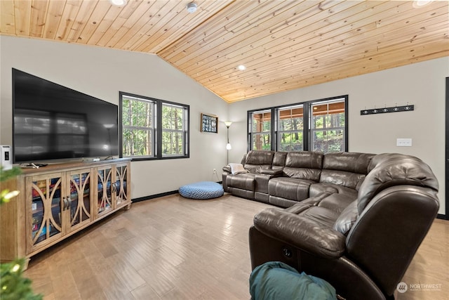 living room with light wood-type flooring, vaulted ceiling, a healthy amount of sunlight, and wood ceiling