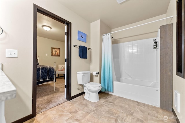 bathroom featuring toilet and shower / tub combo