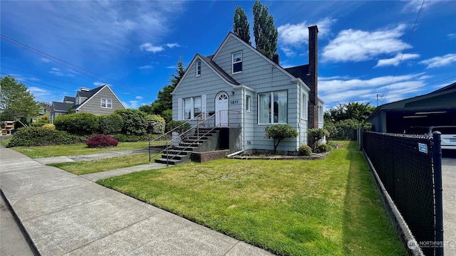 bungalow with a chimney, a front yard, and fence