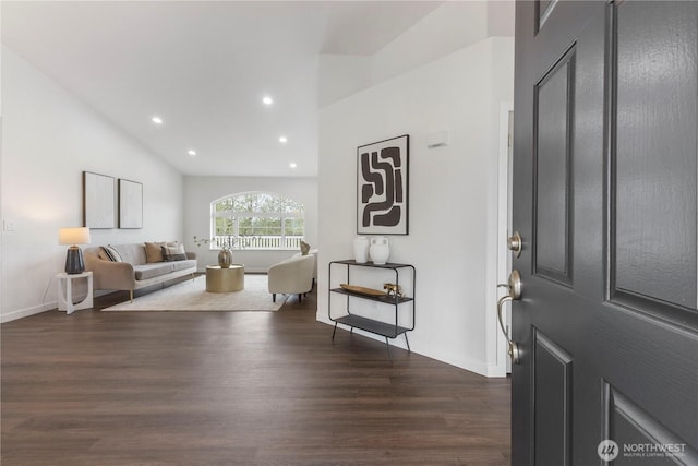foyer with baseboards, recessed lighting, and dark wood-type flooring