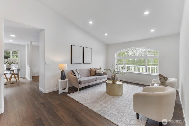 living area with recessed lighting, dark wood-style flooring, baseboards, and vaulted ceiling