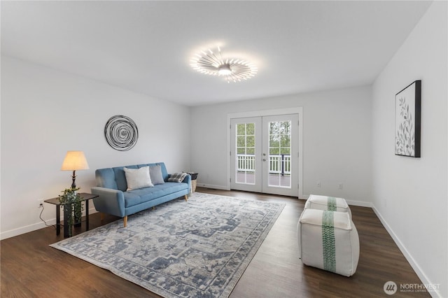 living room with baseboards, french doors, and wood finished floors