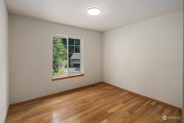 spare room with visible vents and light wood-style flooring