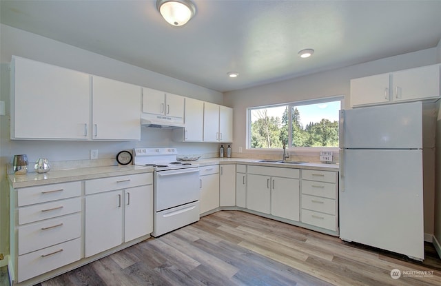 kitchen with white cabinetry, sink, white appliances, and light wood-type flooring