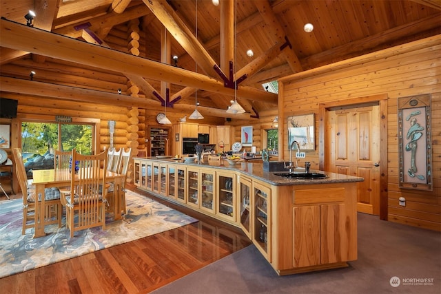 kitchen with sink, high vaulted ceiling, wooden ceiling, beamed ceiling, and hanging light fixtures