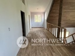 hallway featuring dark wood-type flooring