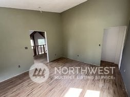 empty room with hardwood / wood-style flooring