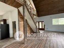 additional living space featuring hardwood / wood-style floors, wood ceiling, and high vaulted ceiling