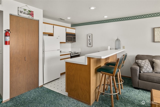 kitchen featuring white refrigerator, white cabinets, range with electric stovetop, light colored carpet, and kitchen peninsula