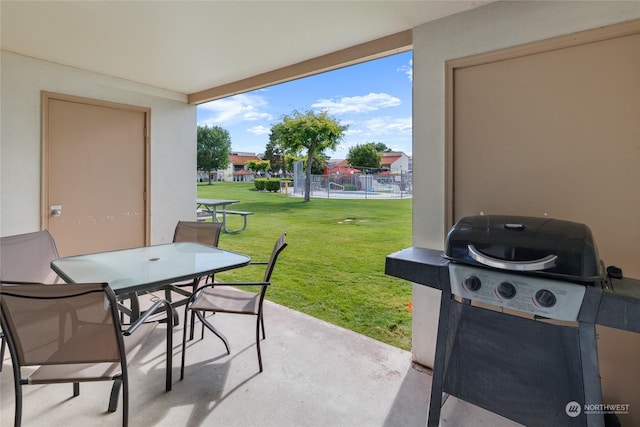 view of patio with a grill and outdoor dining area