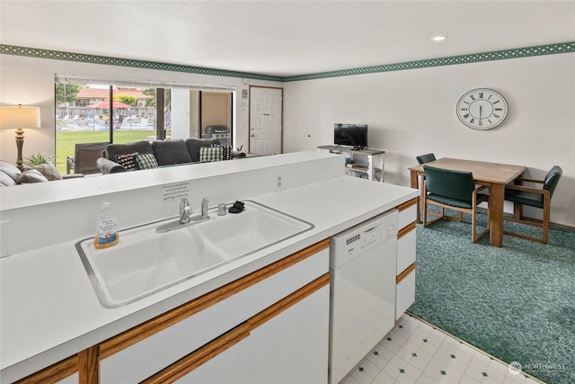kitchen featuring white cabinetry, dishwasher, light countertops, a sink, and open floor plan