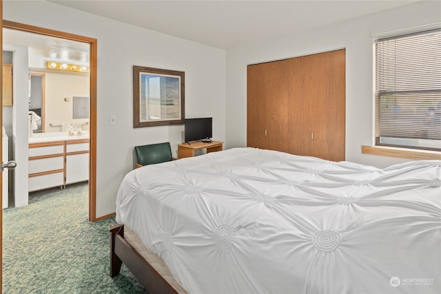 bedroom with ensuite bath, carpet, and a closet