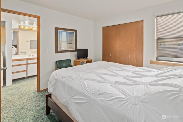 carpeted bedroom featuring a closet and ensuite bathroom