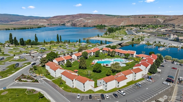 birds eye view of property featuring a water and mountain view