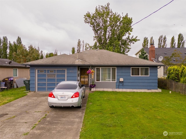 ranch-style home with a garage and a front yard