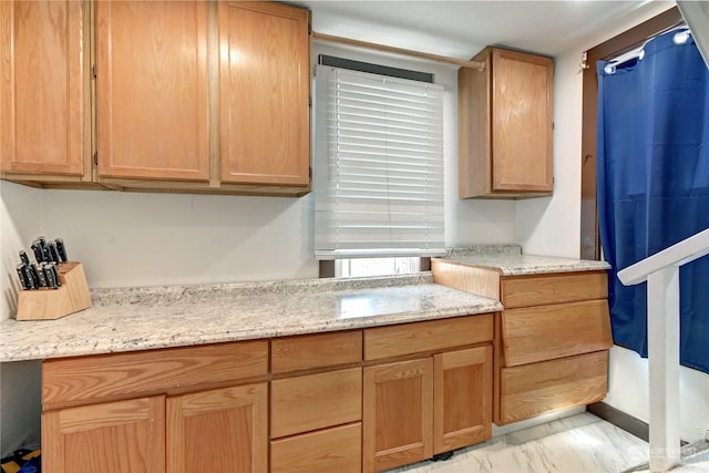 kitchen featuring light stone counters