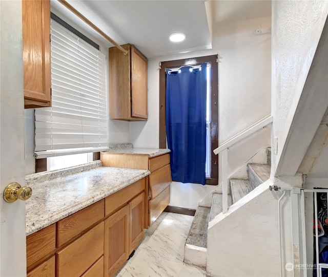 kitchen featuring light stone countertops and light tile patterned floors