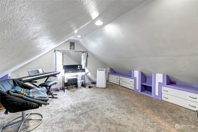 carpeted office featuring a textured ceiling and lofted ceiling