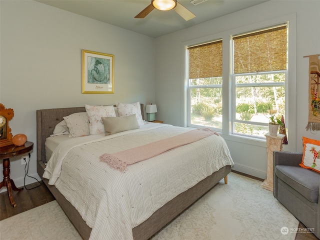 bedroom with hardwood / wood-style flooring and ceiling fan