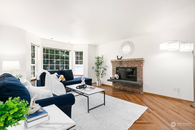 living room featuring parquet floors and a fireplace