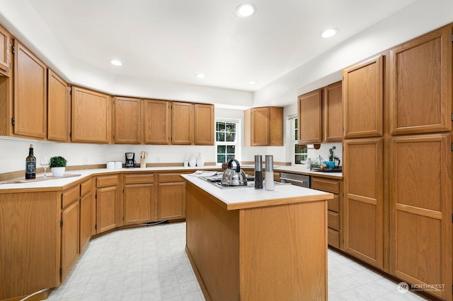 kitchen with dishwasher, a center island, and gas cooktop