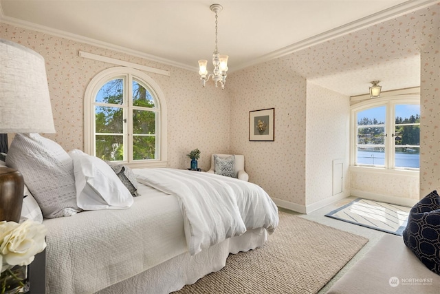 carpeted bedroom featuring crown molding, a water view, a chandelier, baseboards, and wallpapered walls