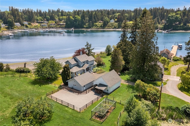 birds eye view of property with a water view