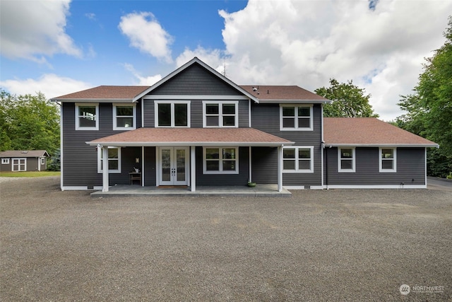 view of front of house with a patio area and french doors