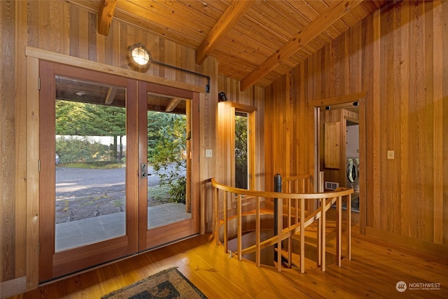 dining area with vaulted ceiling with beams, wood walls, and wood-type flooring