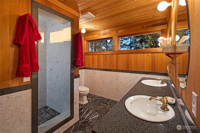 bathroom with marble finish floor, wooden ceiling, a sink, and toilet