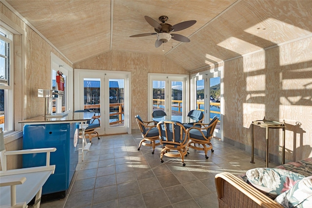 dining space with wooden ceiling, vaulted ceiling, and ceiling fan