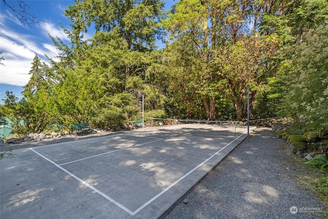 view of sport court with a tennis court