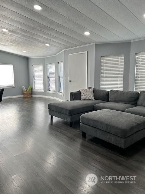 living room with dark hardwood / wood-style flooring and ornamental molding