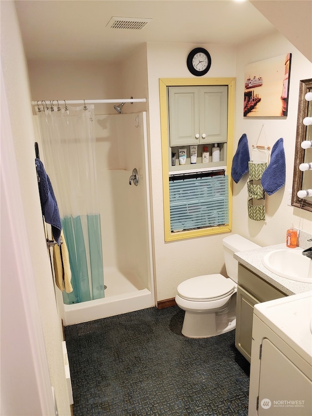 bathroom with tile patterned flooring, washer / clothes dryer, toilet, vanity, and curtained shower