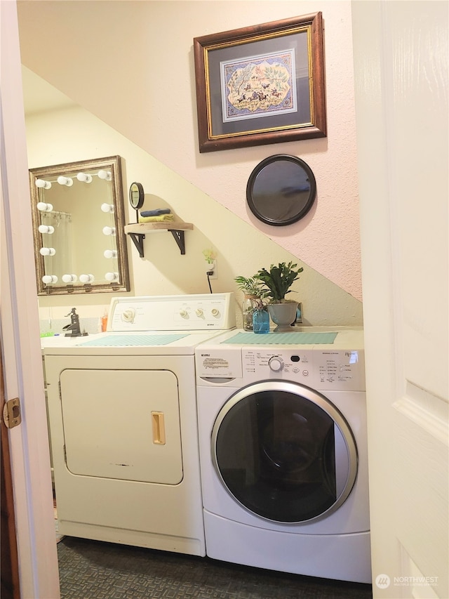 laundry area with separate washer and dryer