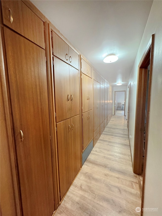 hallway with light wood-type flooring