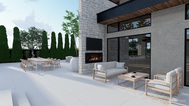 view of patio featuring an outdoor living space with a fireplace