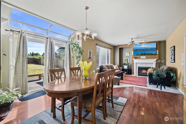 1735 SW 346th Pl, Federal Way, WA 98023 - dining room with dark wood-type flooring, a tiled fireplace, and ceiling fan with notable chandelier