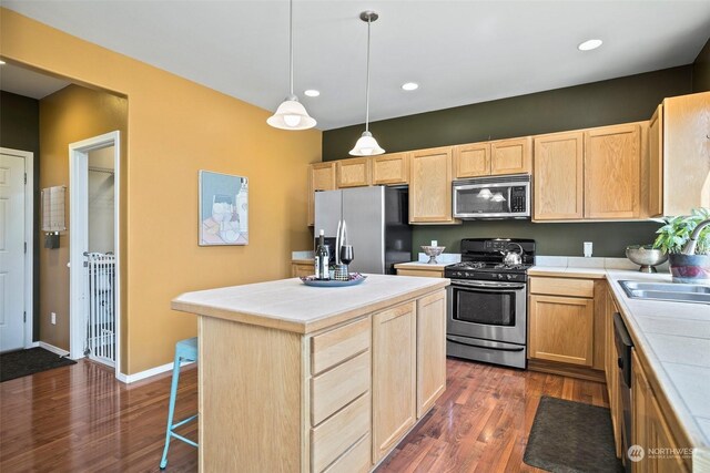 1735 SW 346th Pl, Federal Way, WA 98023 - kitchen with a kitchen island, appliances with stainless steel finishes, and light brown cabinets