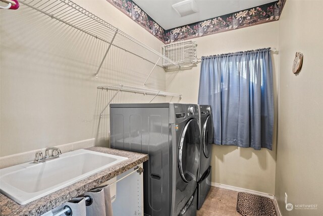 1735 SW 346th Pl, Federal Way, WA 98023 - laundry area with light tile patterned flooring, washing machine and clothes dryer, and sink